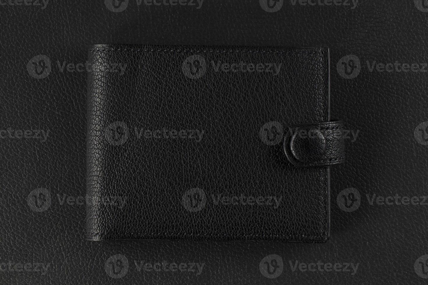 Black leather product closeup on a black background. photo