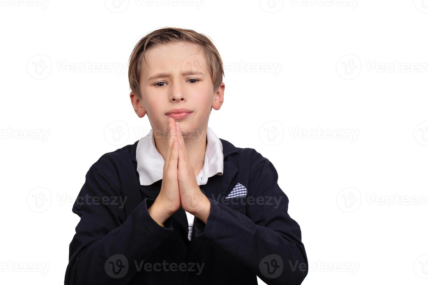 Portrait of a boy asking for something on a white background in close-up. photo