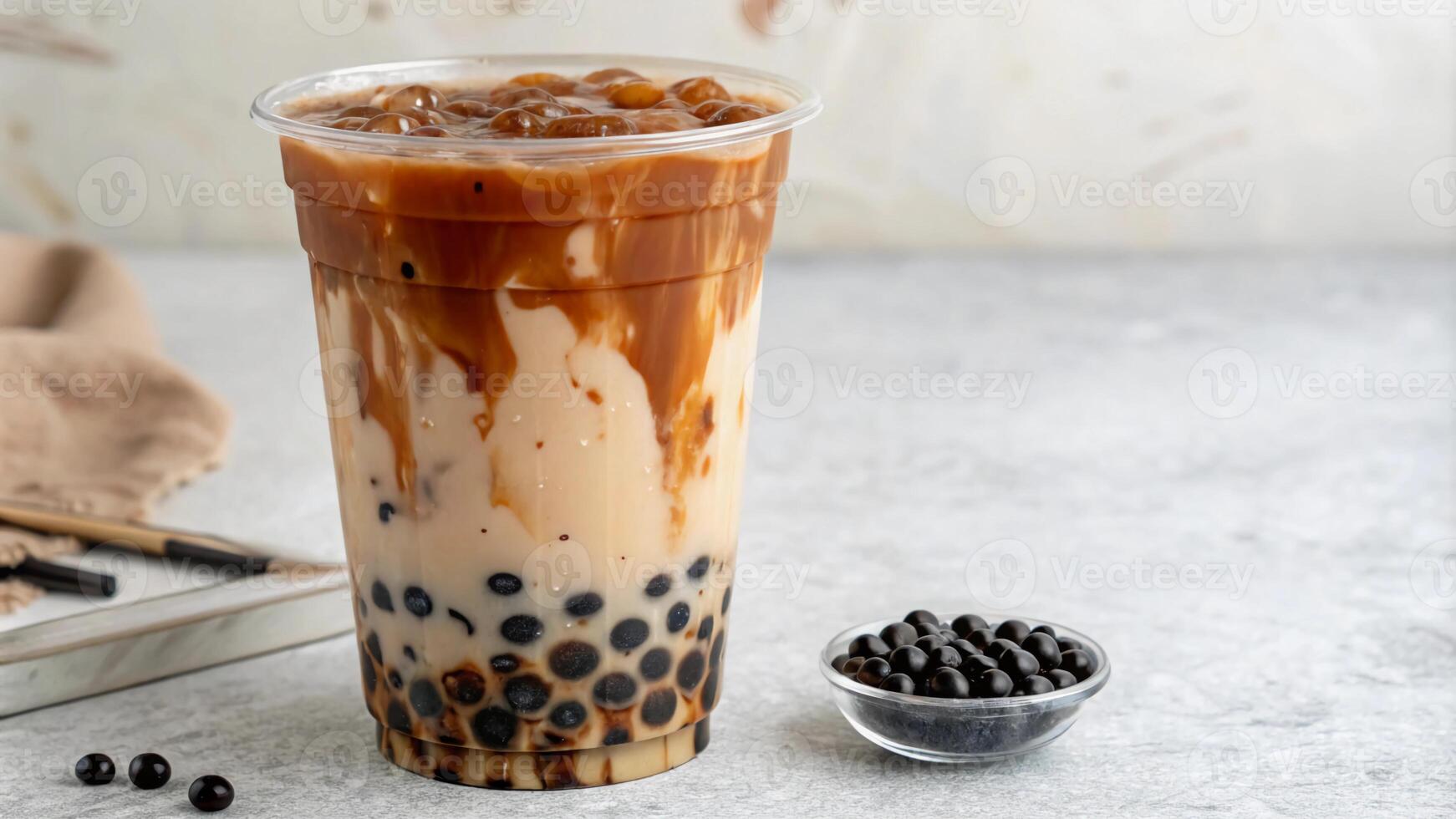 A glass of bubble tea with black beans photo