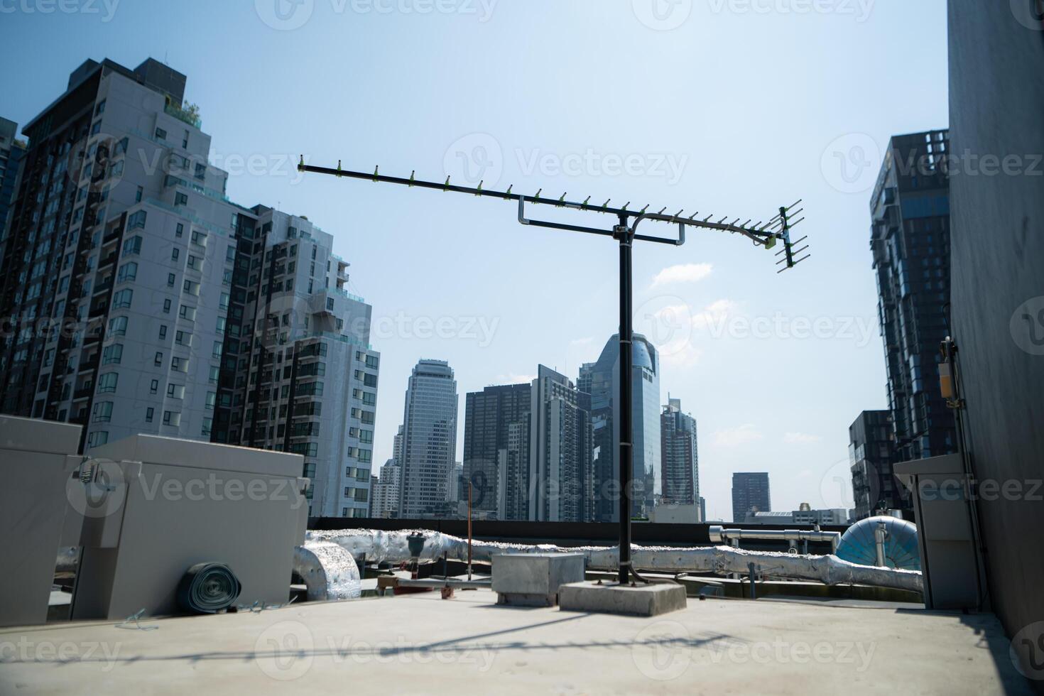 An old television signal antenna in the middle of the city. that still have some to receive signals photo