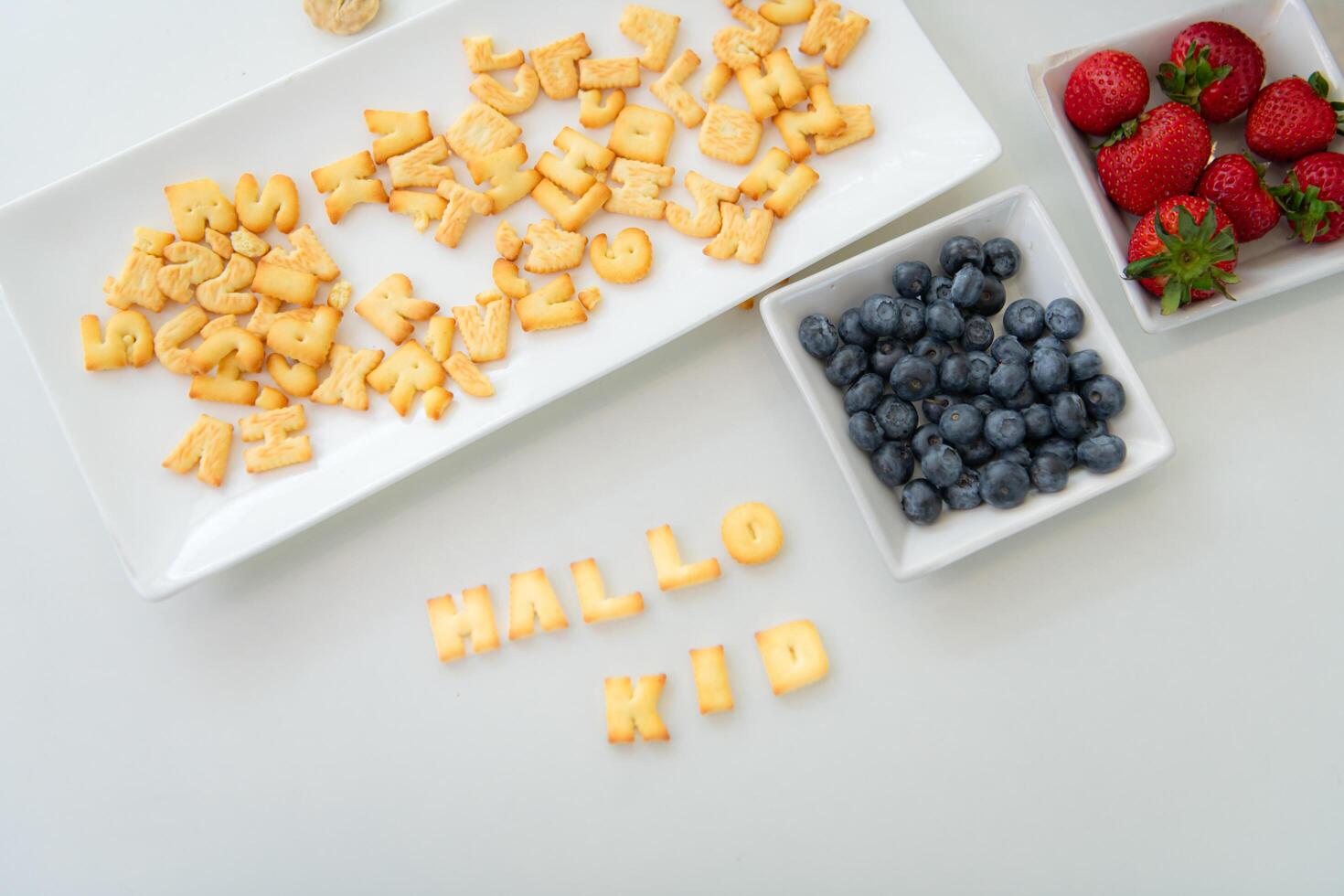 Snacks and fruits on the table that the mother prepared for the little daughters to eat as a snack photo
