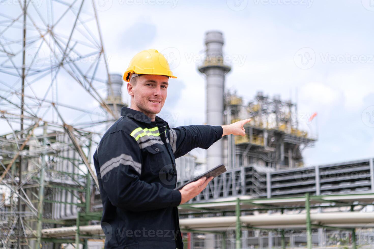 Petroleum engineer is on a mission to inspect oil distillation at a huge oil refinery photo