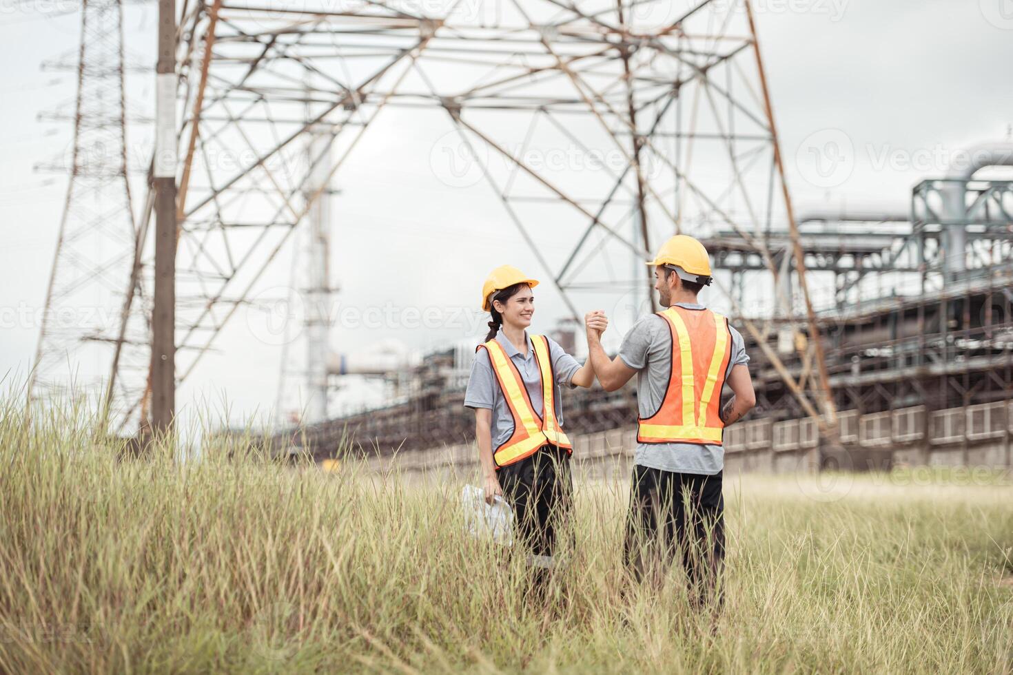 Both of Petroleum engineer is on a mission to inspect oil distillation at a huge oil refinery photo