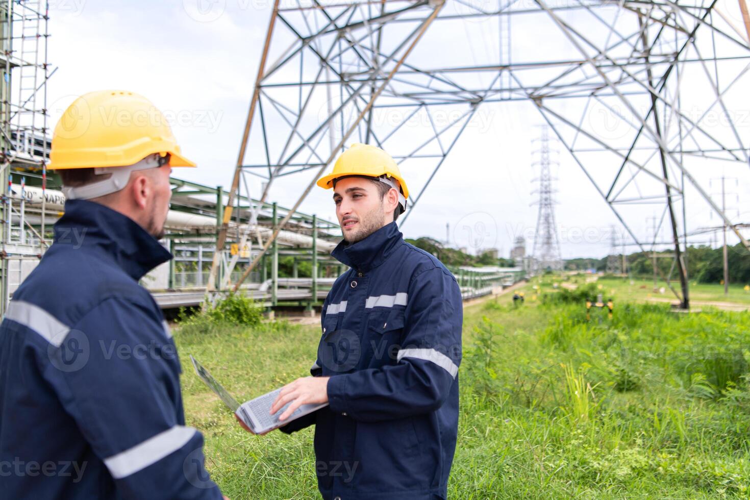 Both of Petroleum engineer is on a mission to inspect oil distillation at a huge oil refinery photo