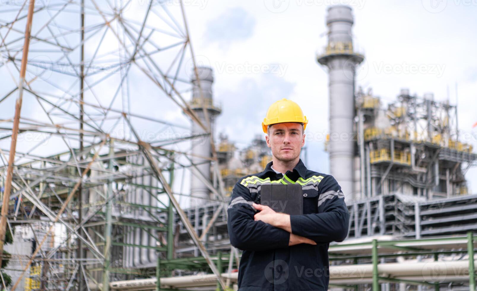 Petroleum engineer is on a mission to inspect oil distillation at a huge oil refinery photo