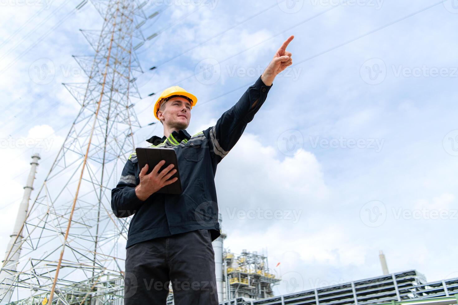 Petroleum engineer is on a mission to inspect oil distillation at a huge oil refinery photo