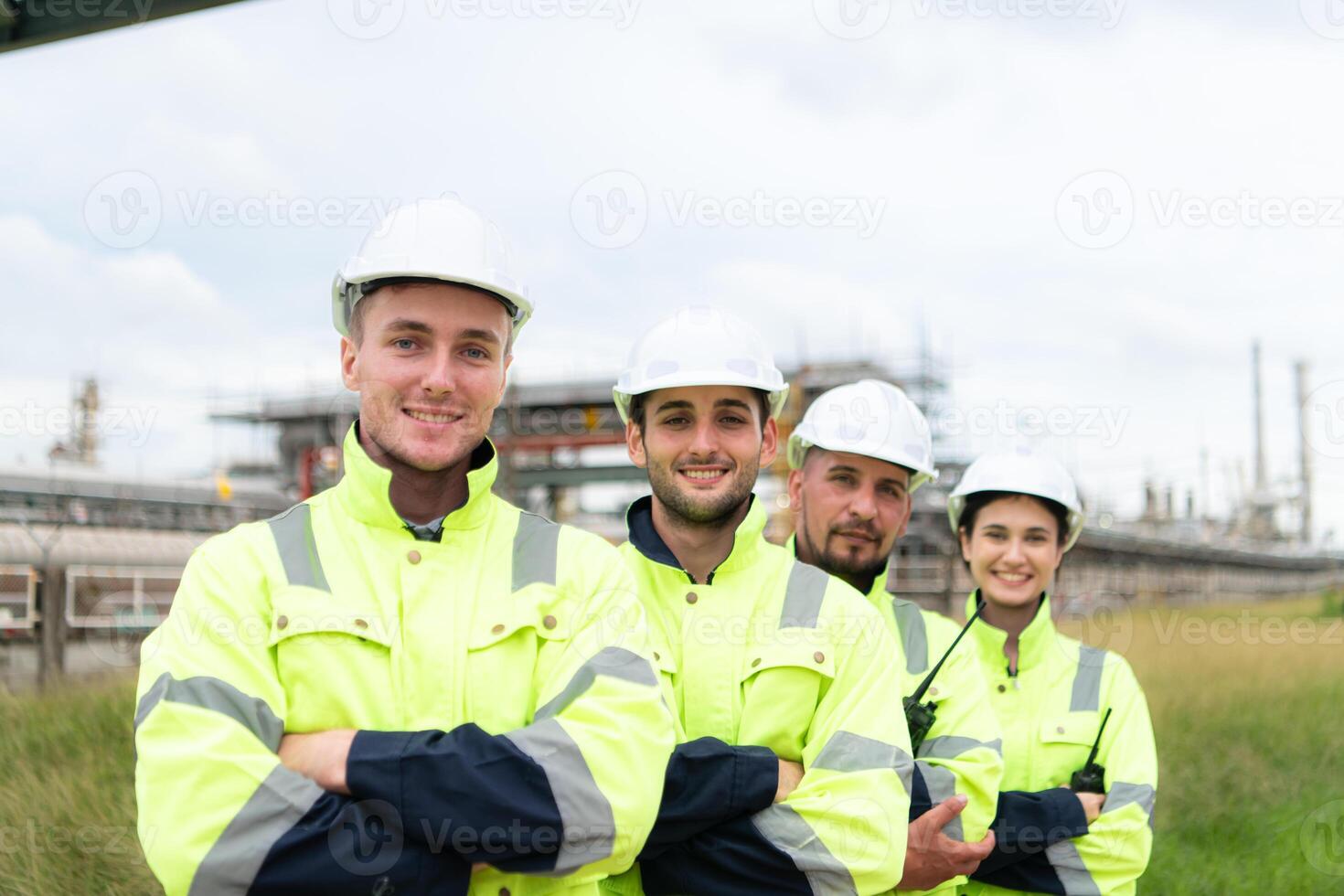 Group of Petroleum engineer is on a mission to inspect oil distillation at a huge oil refinery photo