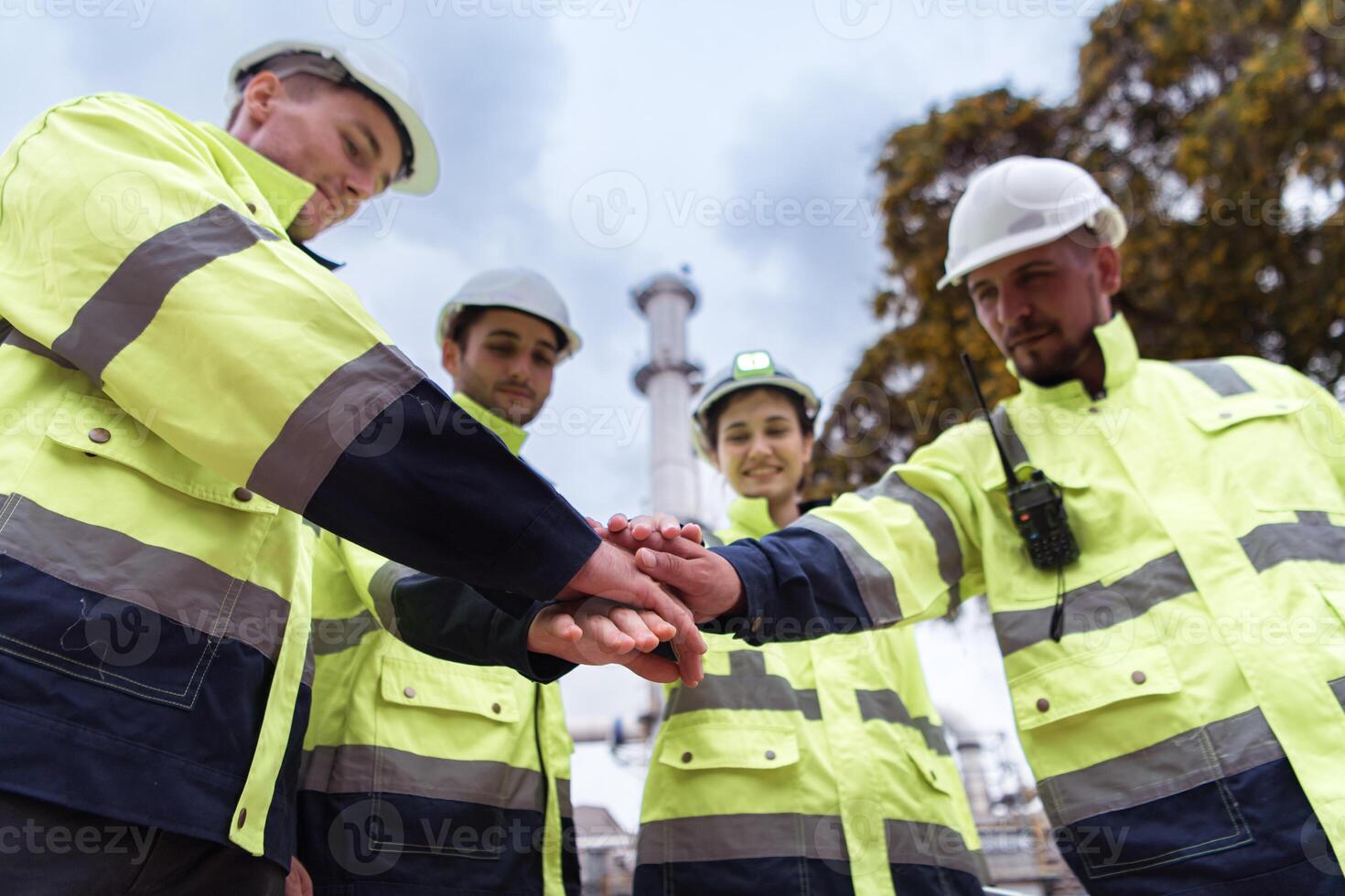 Group of Petroleum engineer is on a mission to inspect oil distillation at a huge oil refinery photo