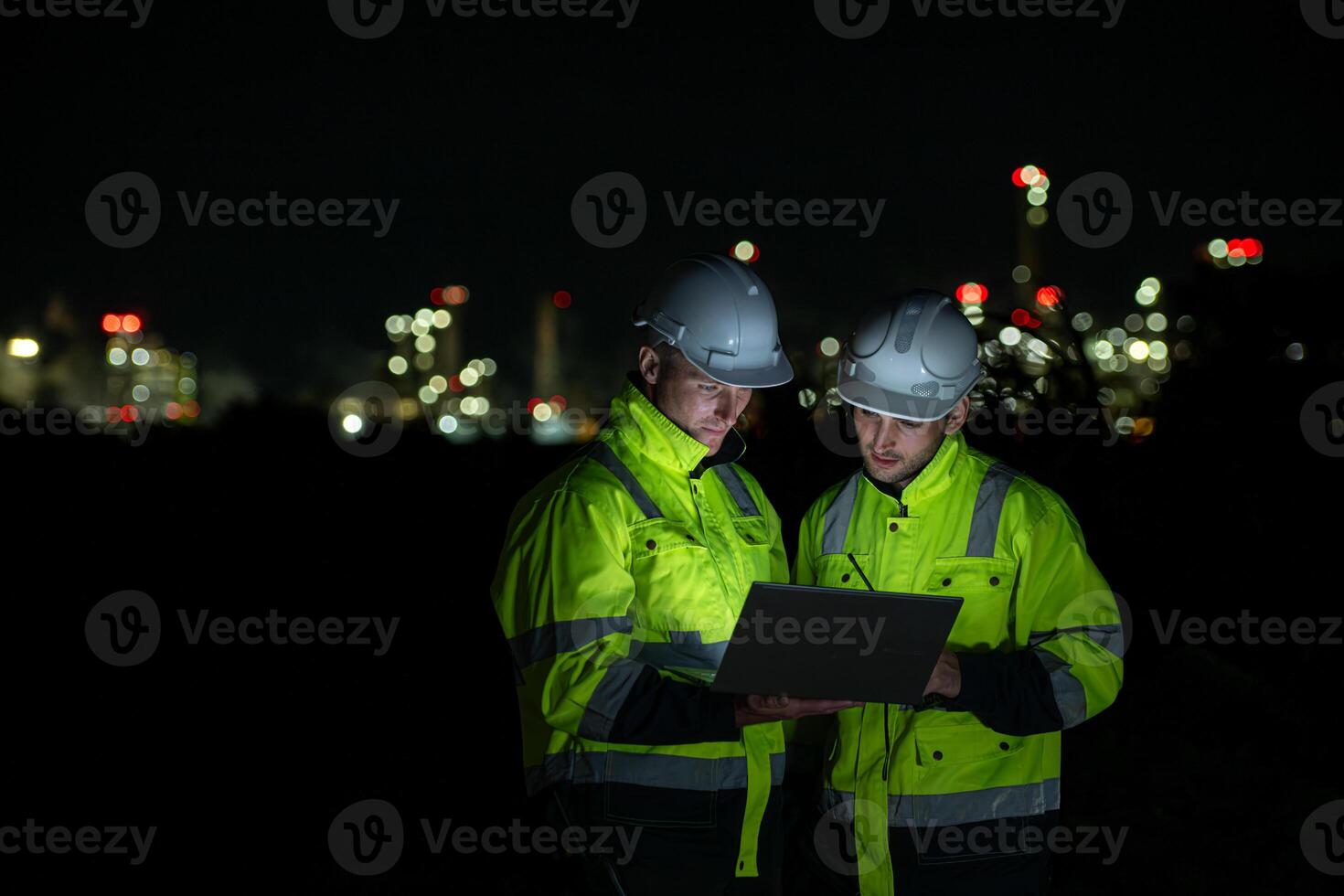 Both of Petroleum engineer is on a mission to inspect oil distillation at a huge oil refinery photo