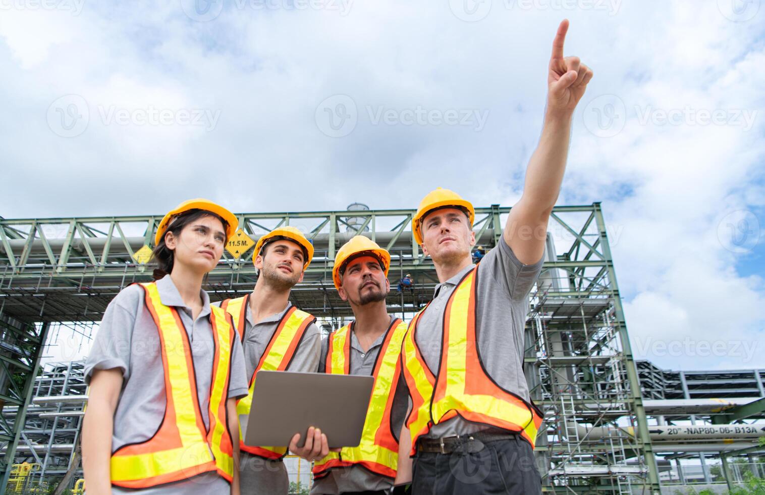 Group of Petroleum engineer is on a mission to inspect oil distillation at a huge oil refinery photo