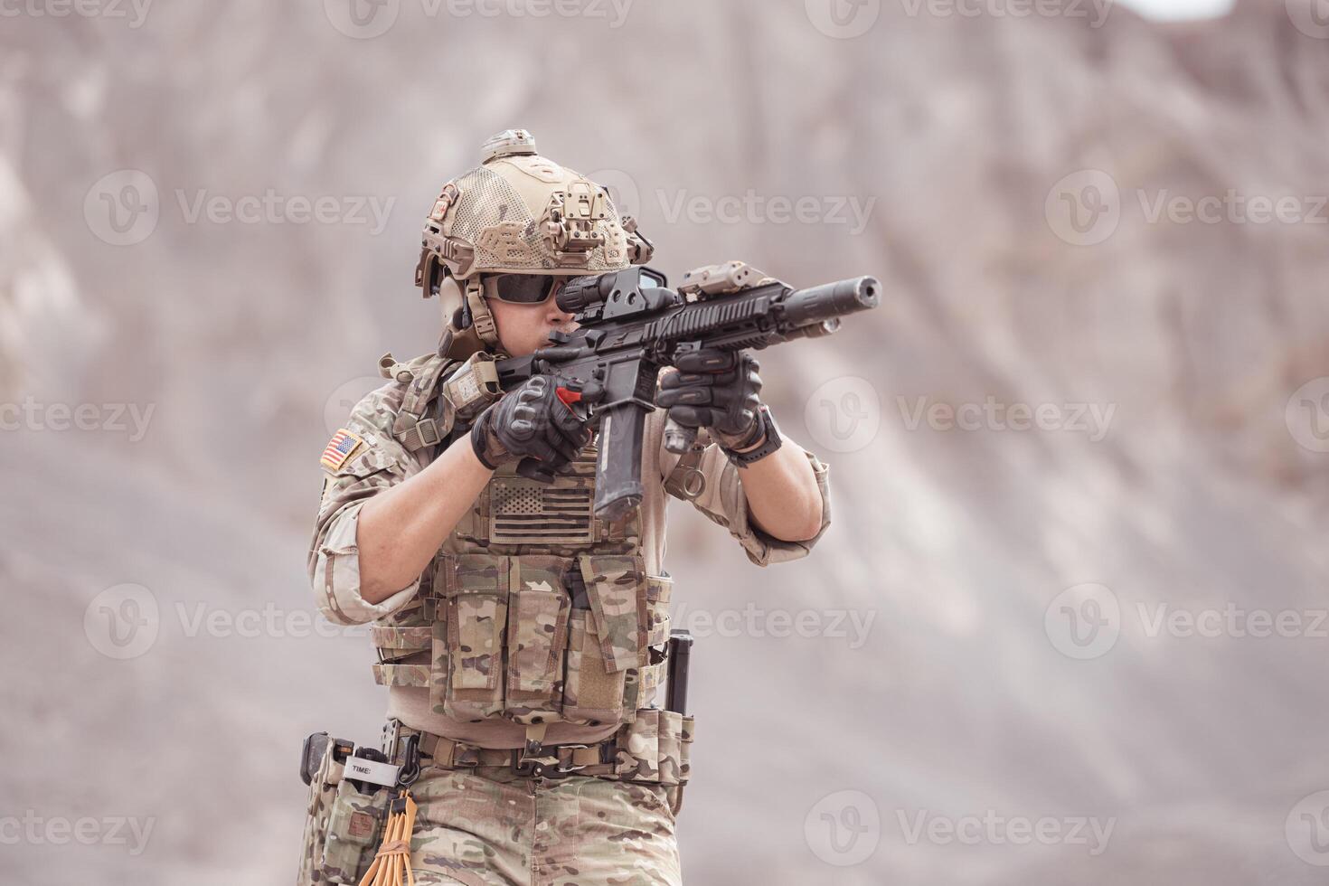 Soldiers in camouflage military uniforms carrying weapons, Reconnaissance missions in rugged mountains, Assault infantry battle training. photo