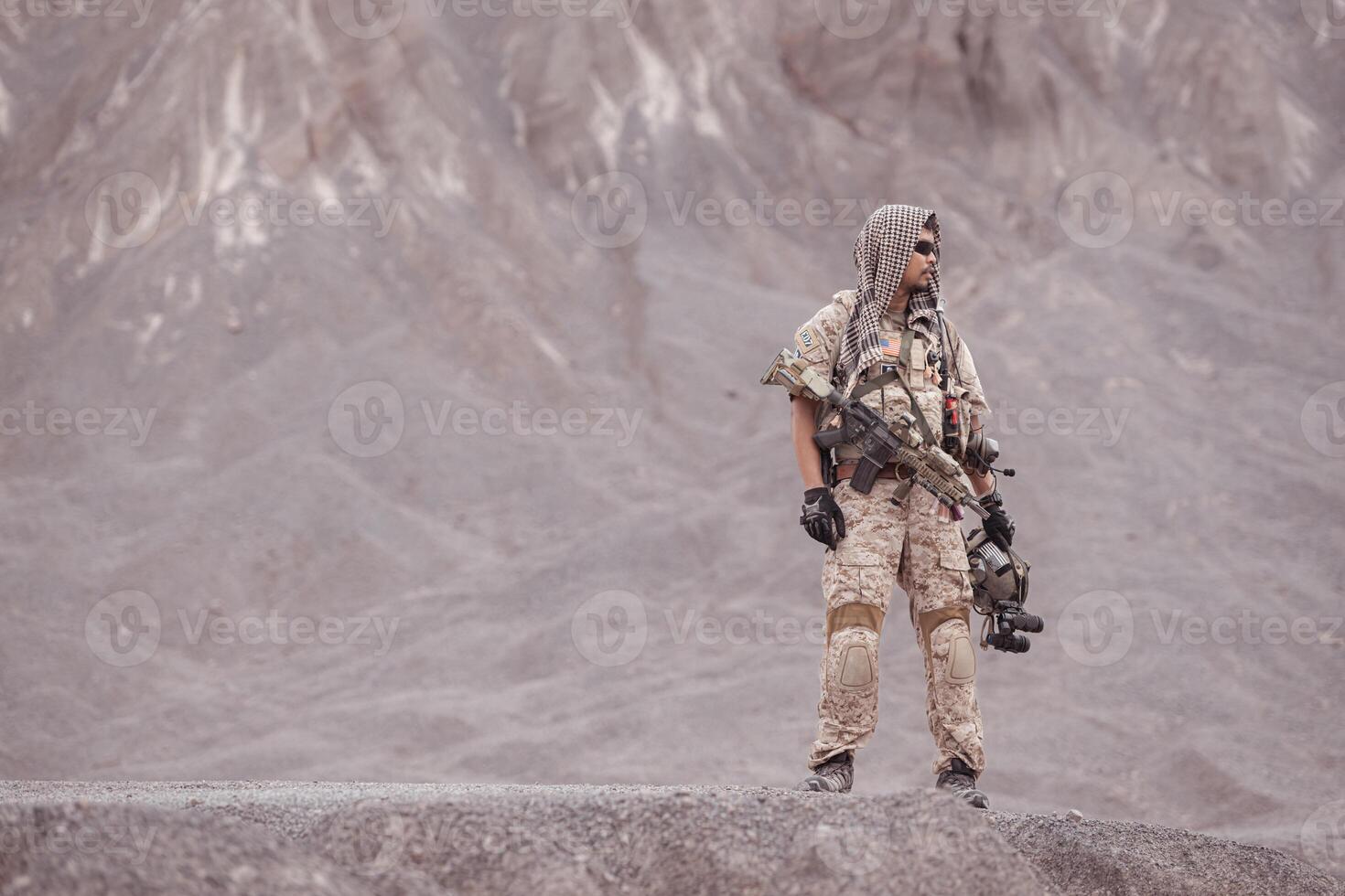Soldiers in camouflage military uniforms carrying weapons, Reconnaissance missions in rugged mountains, Assault infantry battle training. photo