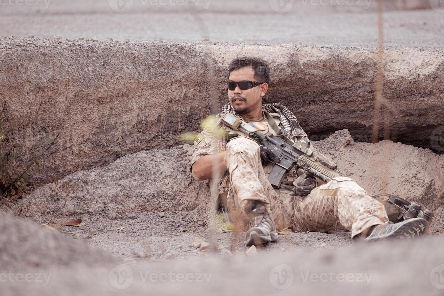 Soldiers in camouflage military uniforms carrying weapons, Reconnaissance missions in rugged mountains, Assault infantry battle training. photo