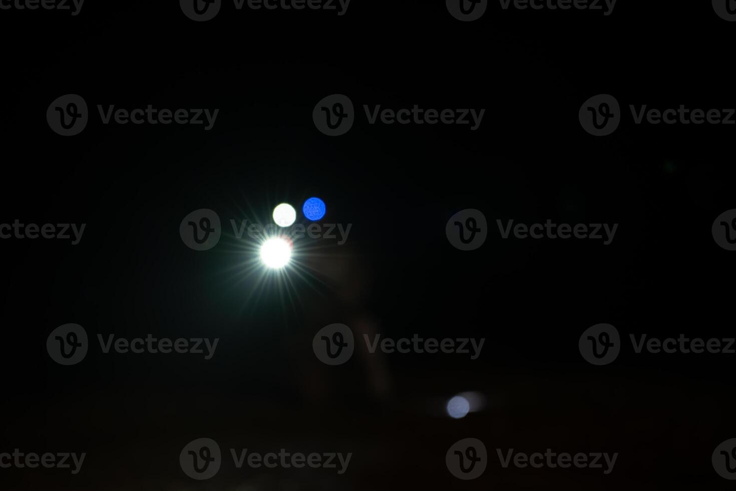 Soldiers in camouflage uniforms hold weapons with patrol missions at night photo