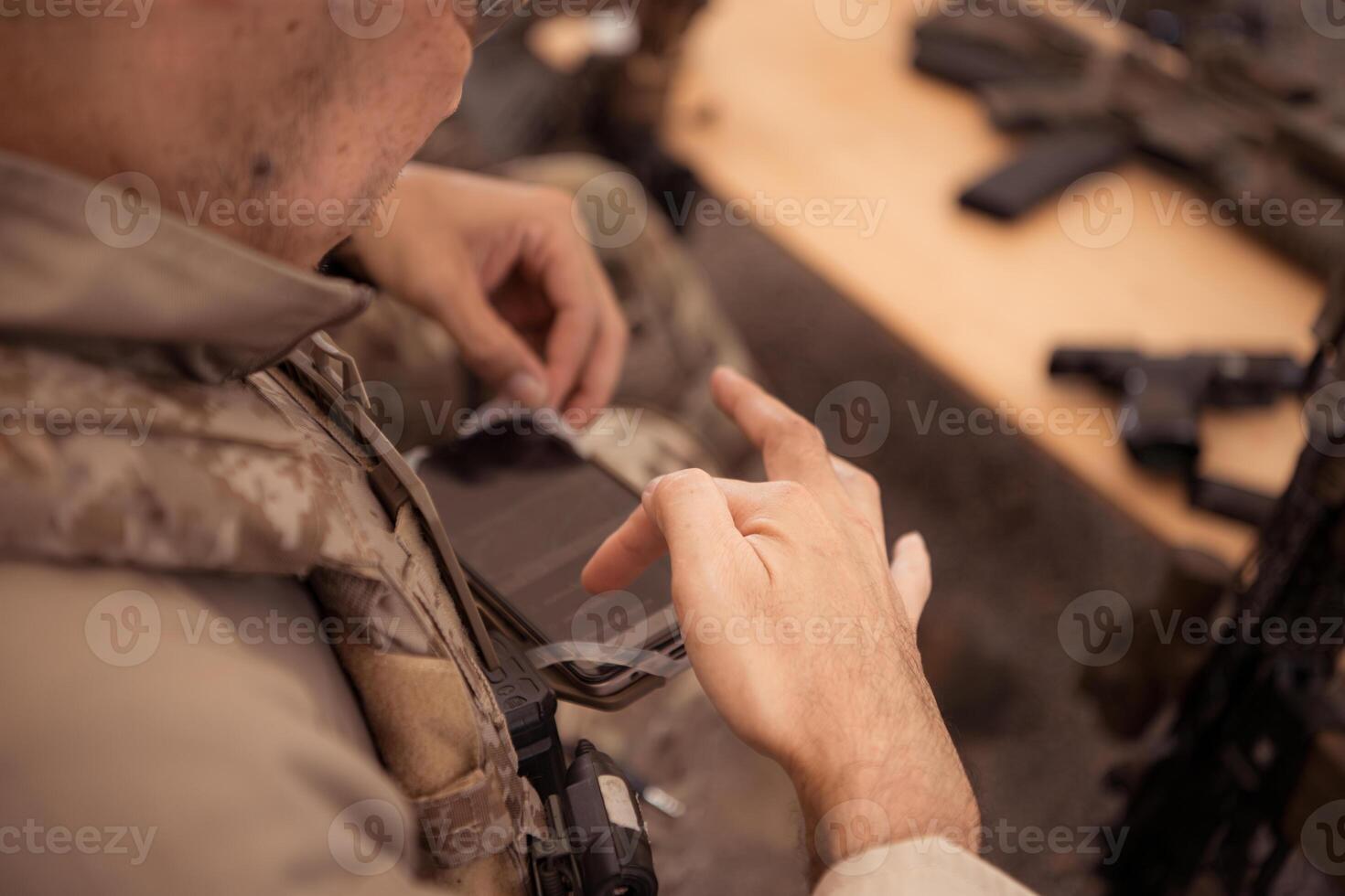 Group of soldiers in camouflage uniforms hold weapons in a field tent, Plan and prepare for combat training. photo