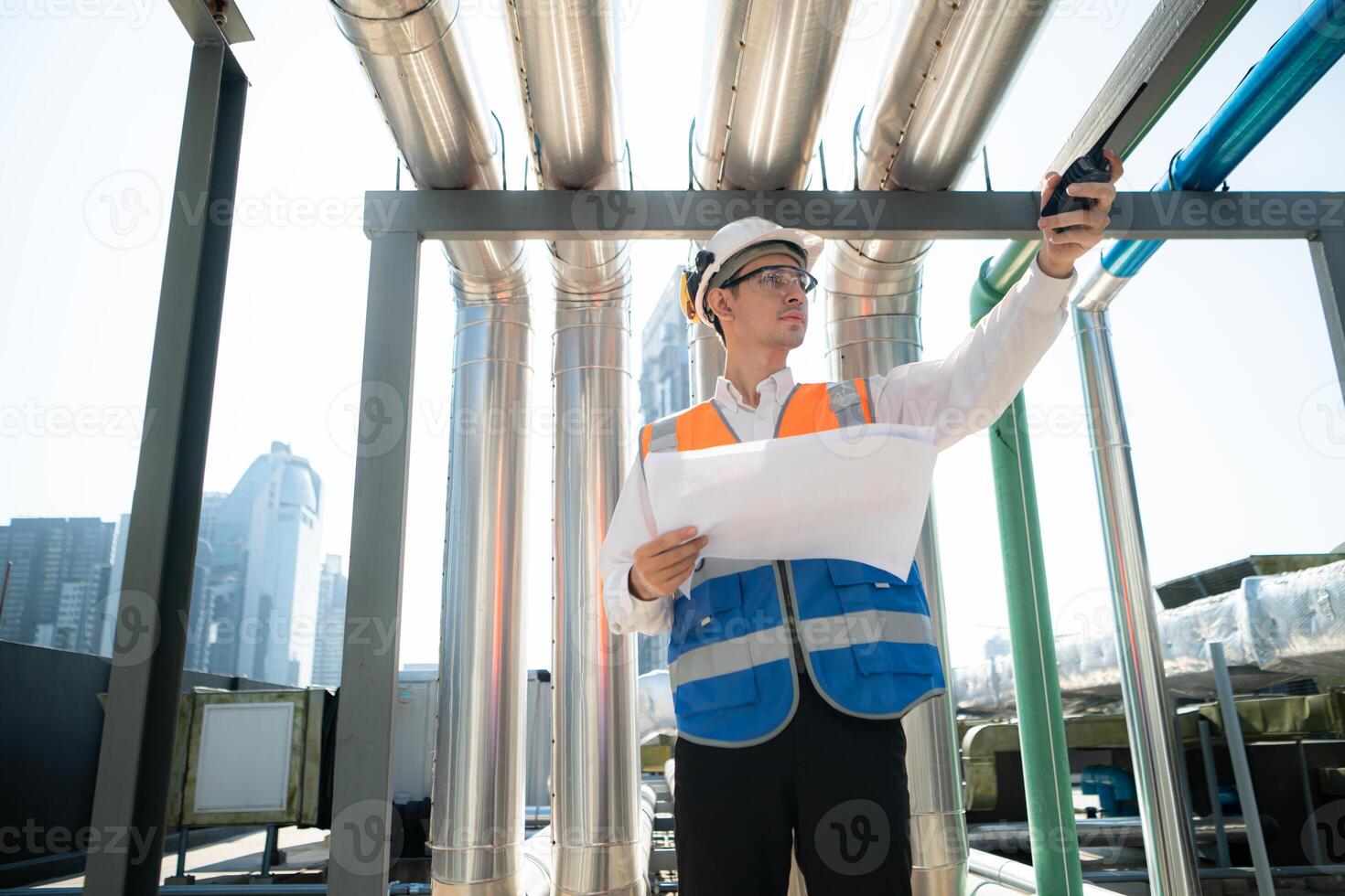 Engineers inspect the completed air conditioning and water systems to continue verifying their functionality. photo