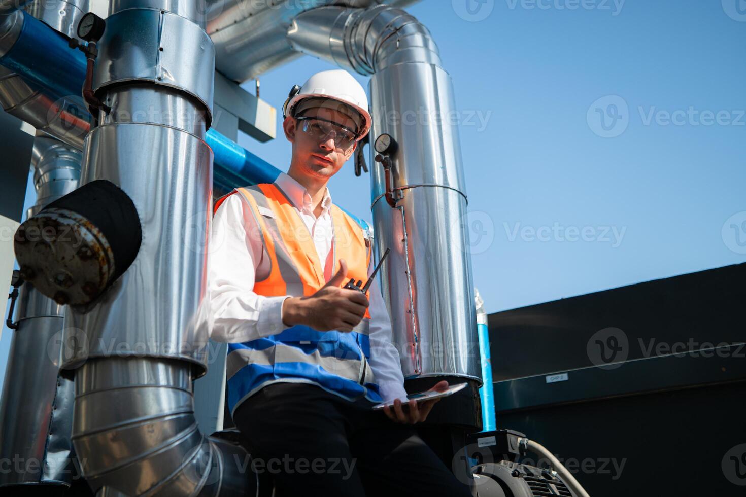 Engineers inspect the completed air conditioning and water systems to continue verifying their functionality. photo