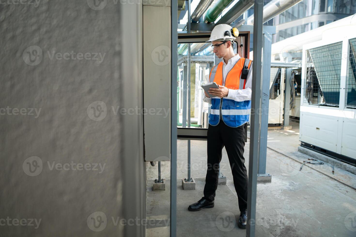 Before proceeding with the testing, Electrical engineer inspects the installed control panel. photo