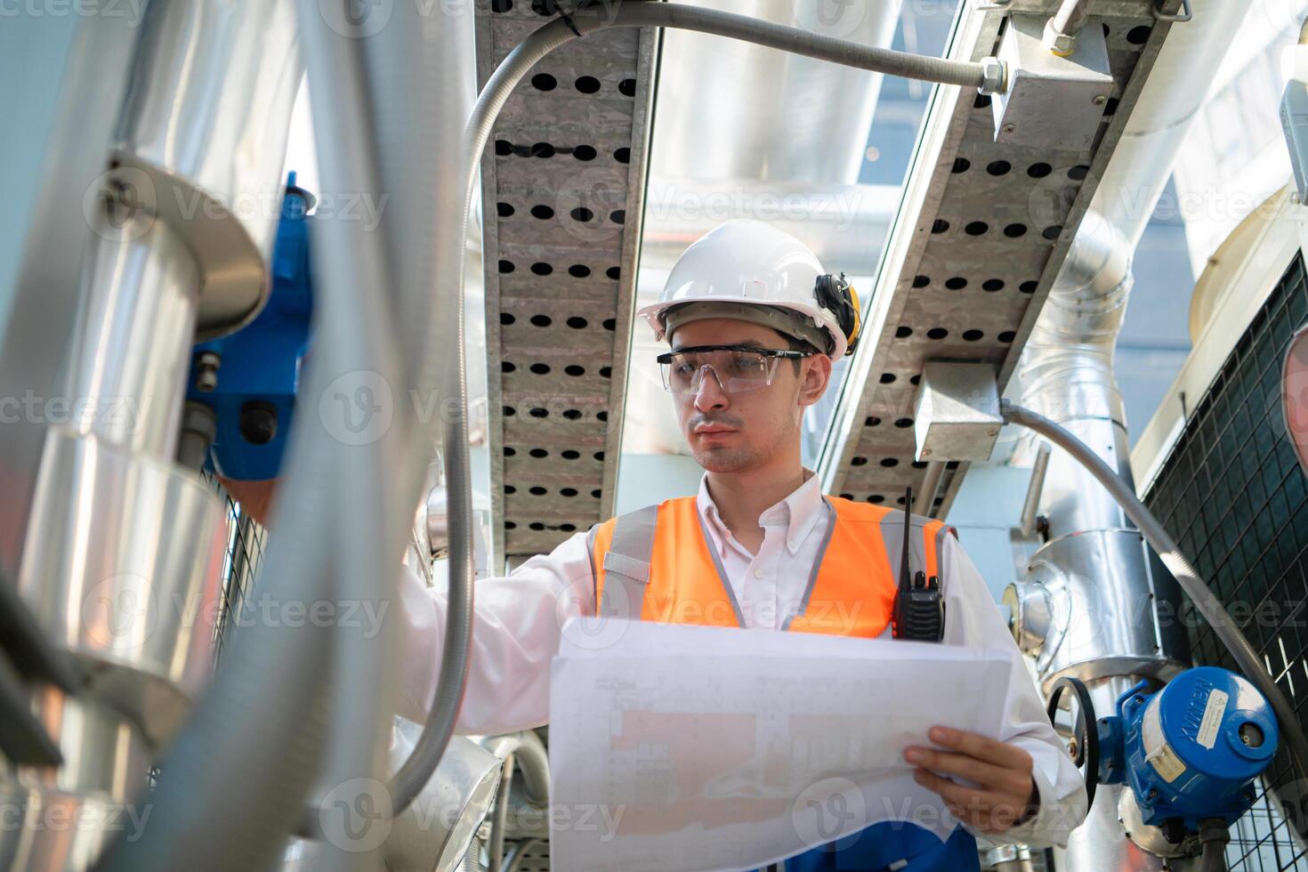 Engineers inspect the completed air conditioning and water systems to continue verifying their functionality. photo