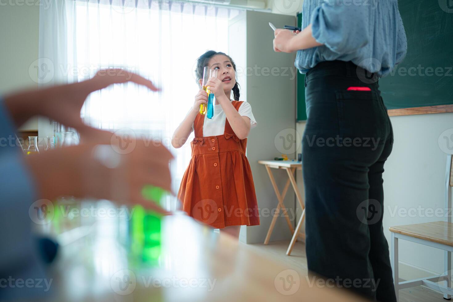 Teacher and students, Learn and experiment with science in a school science classroom. photo