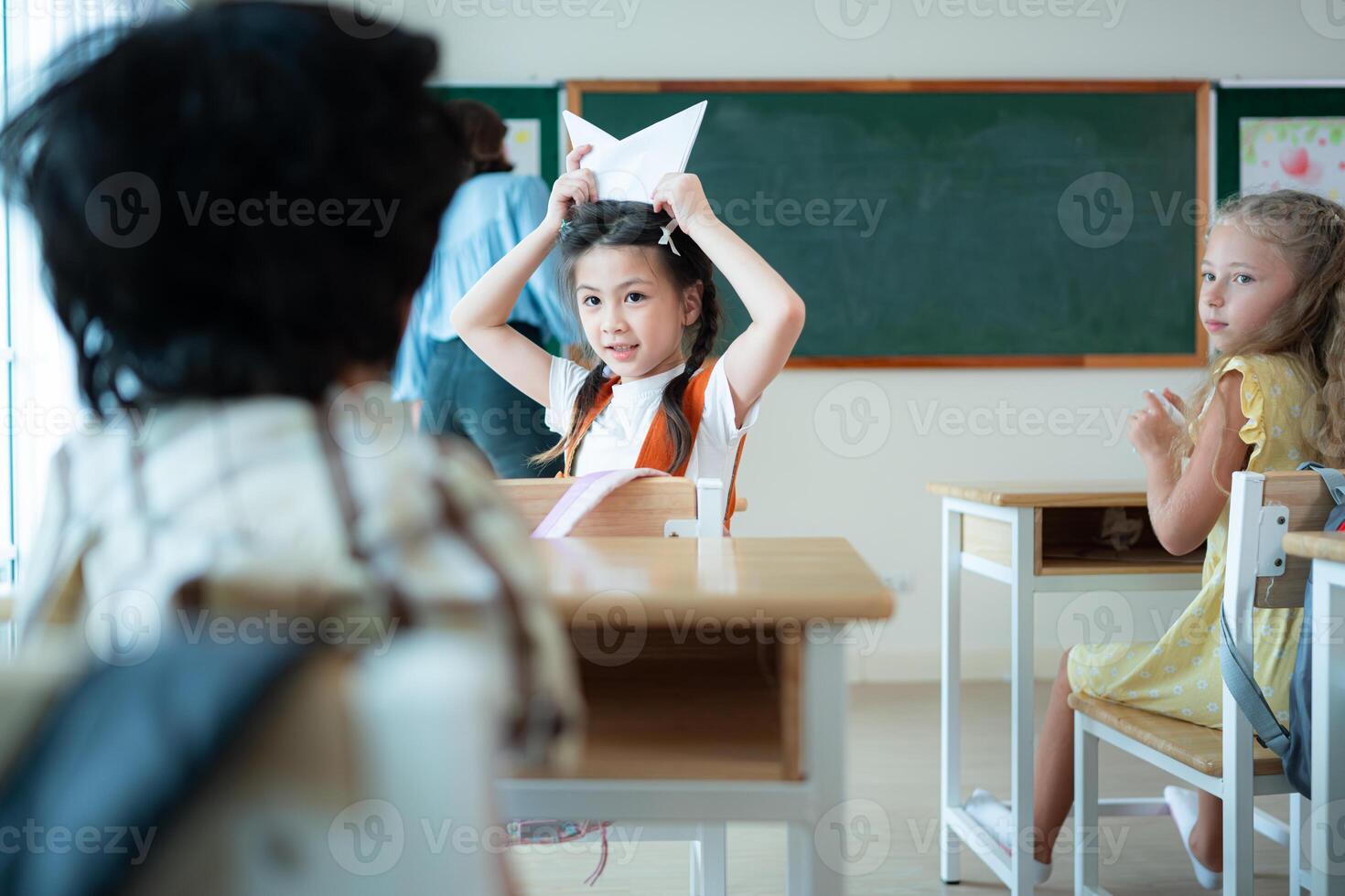 Teacher and students, Learn and study in a classroom of school where youngsters sit and listen attentively. photo