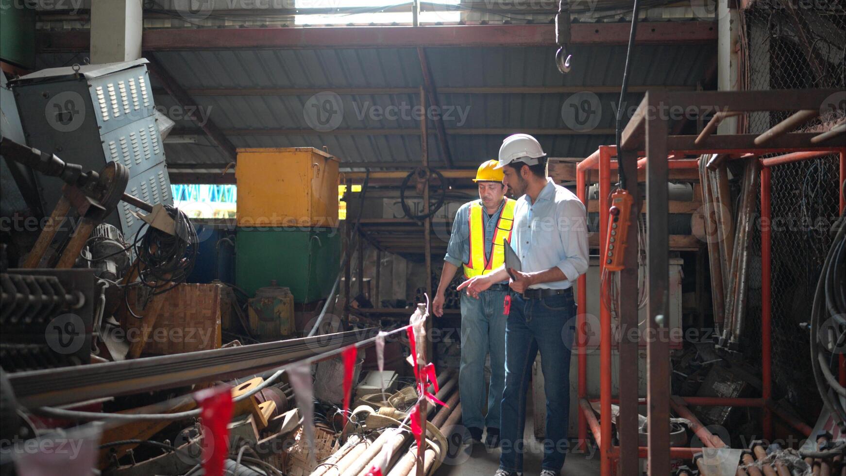 Foreman and worker on construction crane inspection is made to transport the crane from storage to be assembled on the building construction site photo