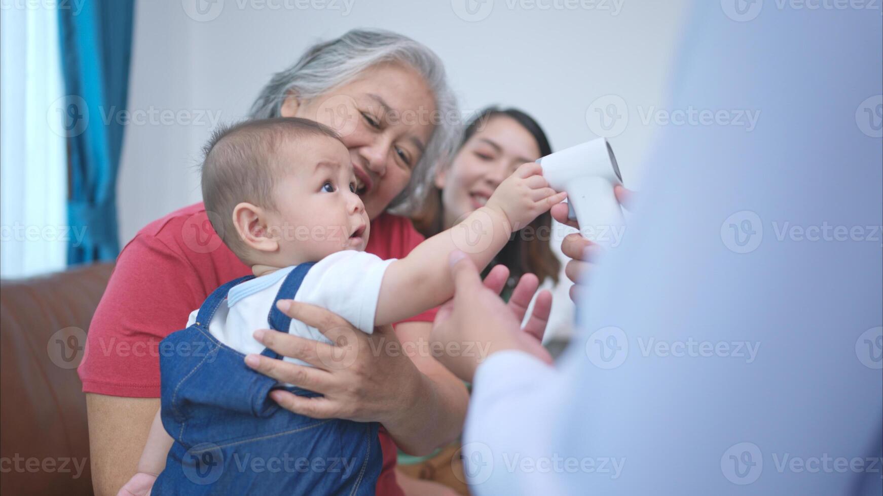 A little child and his family visit the doctor for a routine health checkup photo