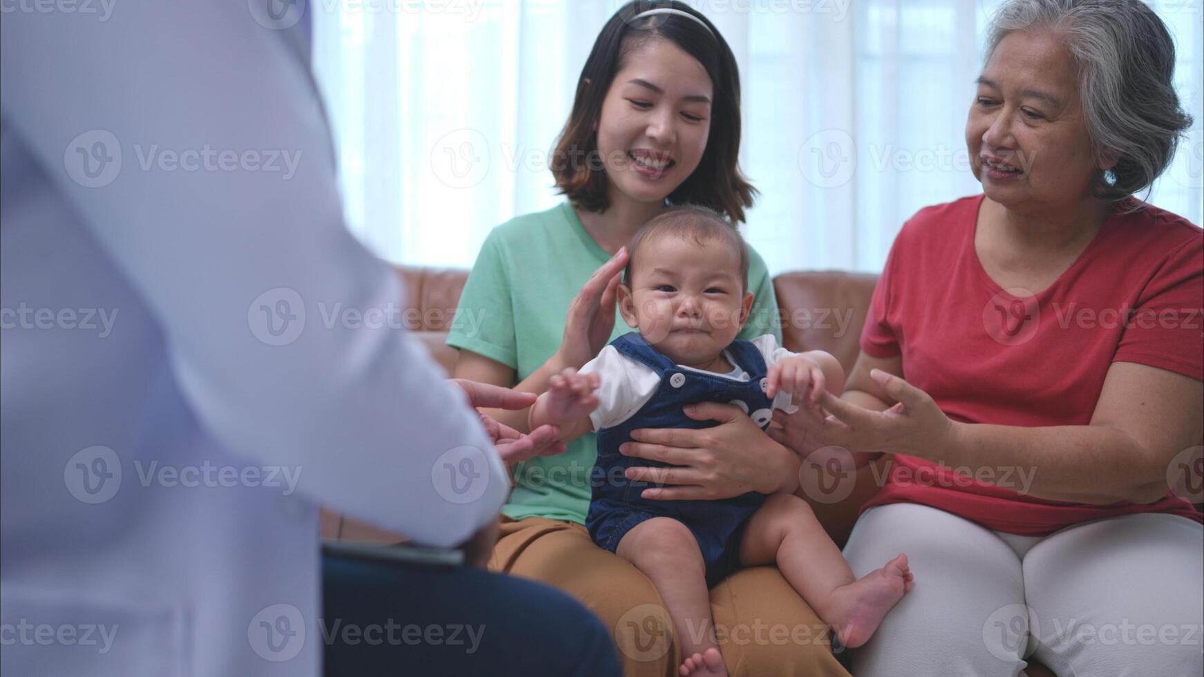 A little child and his family visit the doctor for a routine health checkup photo