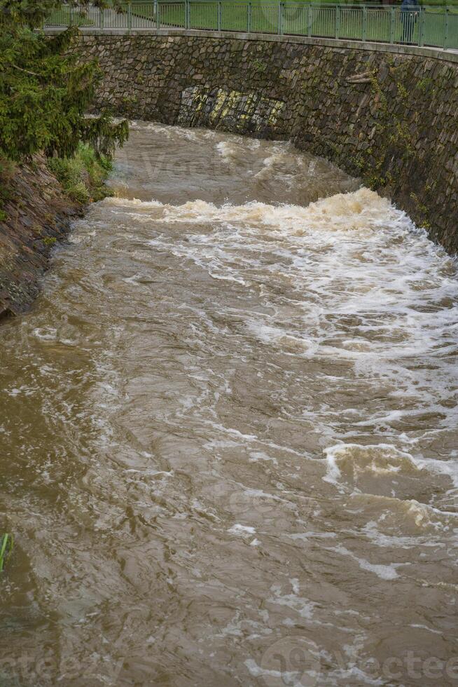 Prague, Czech Republic - September 16, 2024. Rokytka river in Palmovka district during the flood photo