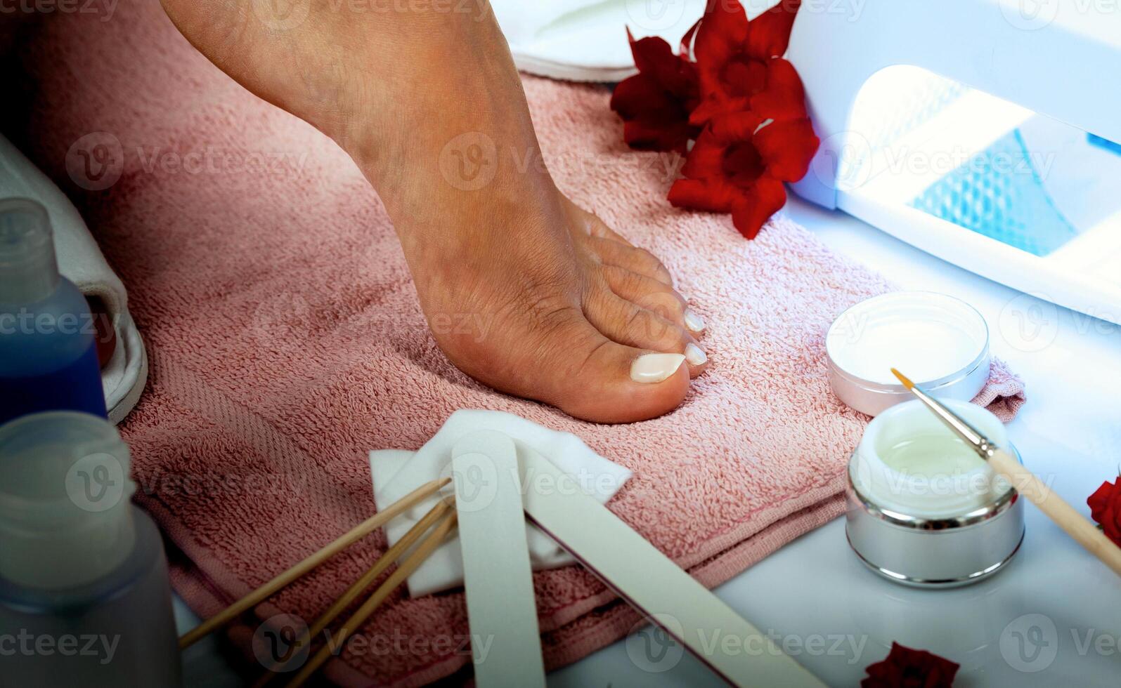 A woman's feet are being prepared for a pedicure photo