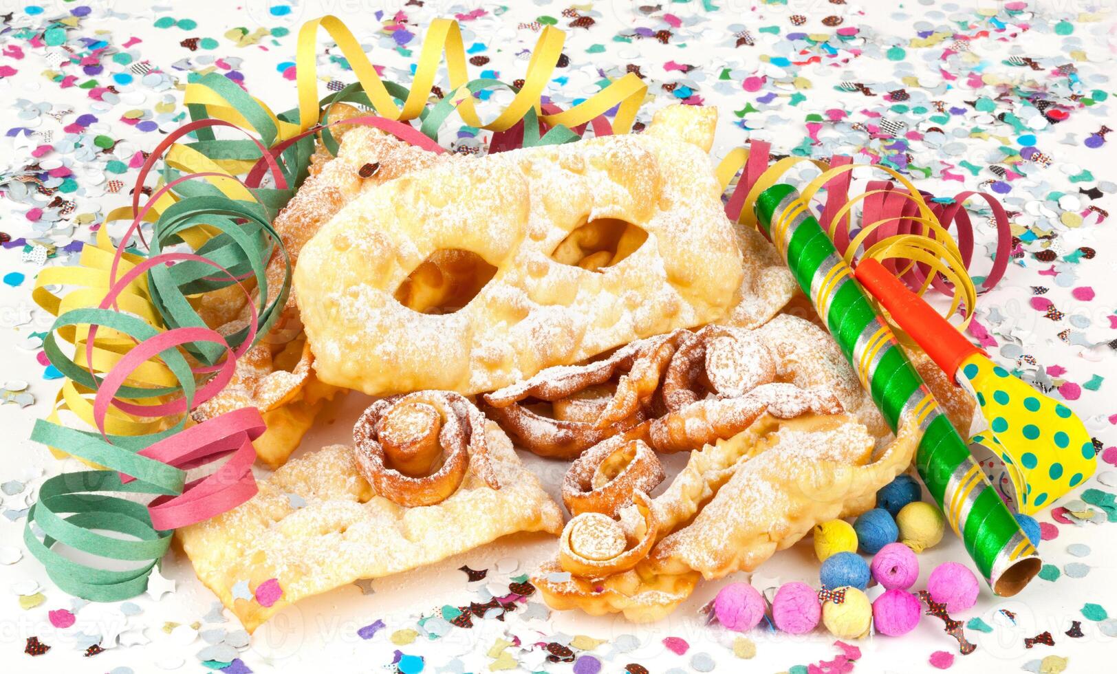 A bunch of colorful confetti and candy on a white background photo