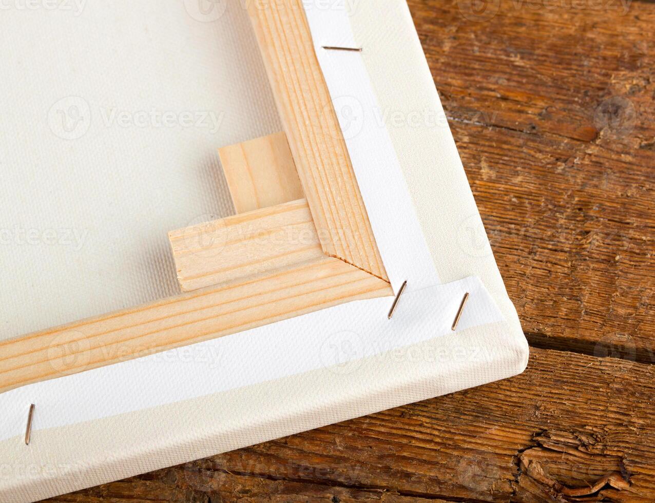 A wooden table with a white frame sitting on it photo