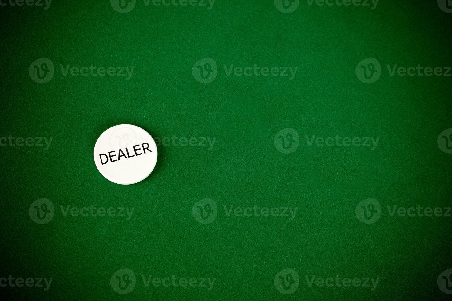 Dealer sign on a green table photo