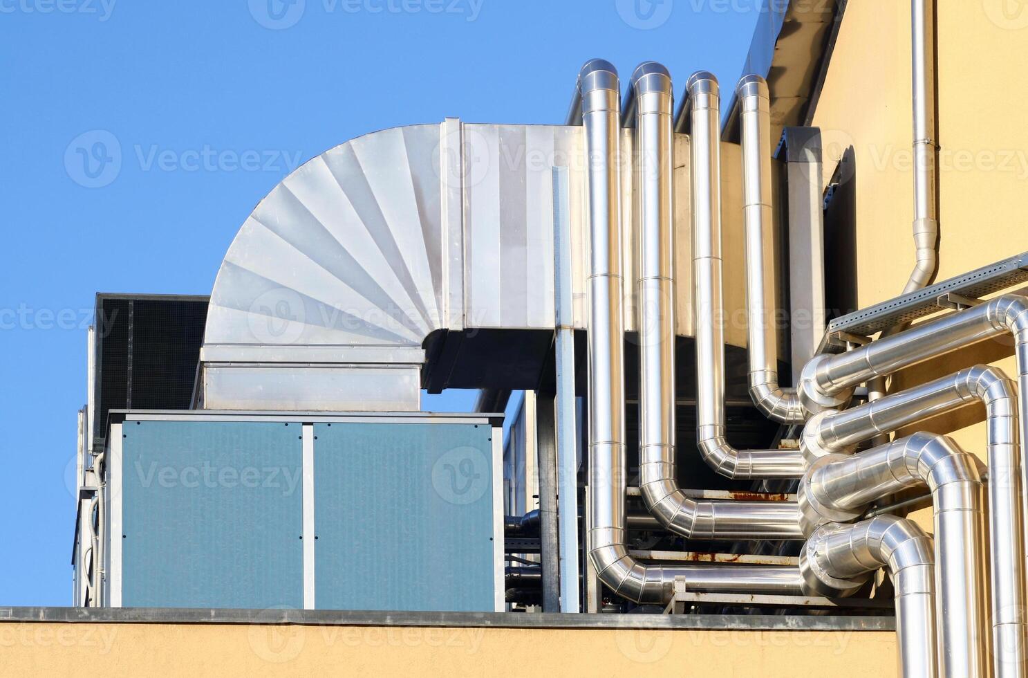 A close up of pipes on a building photo