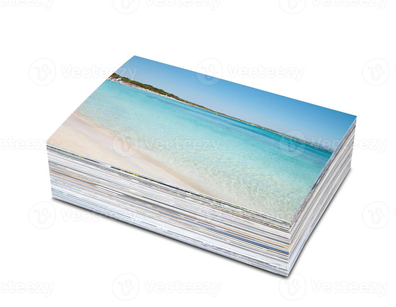 A stack of postcards with a beach scene on them photo