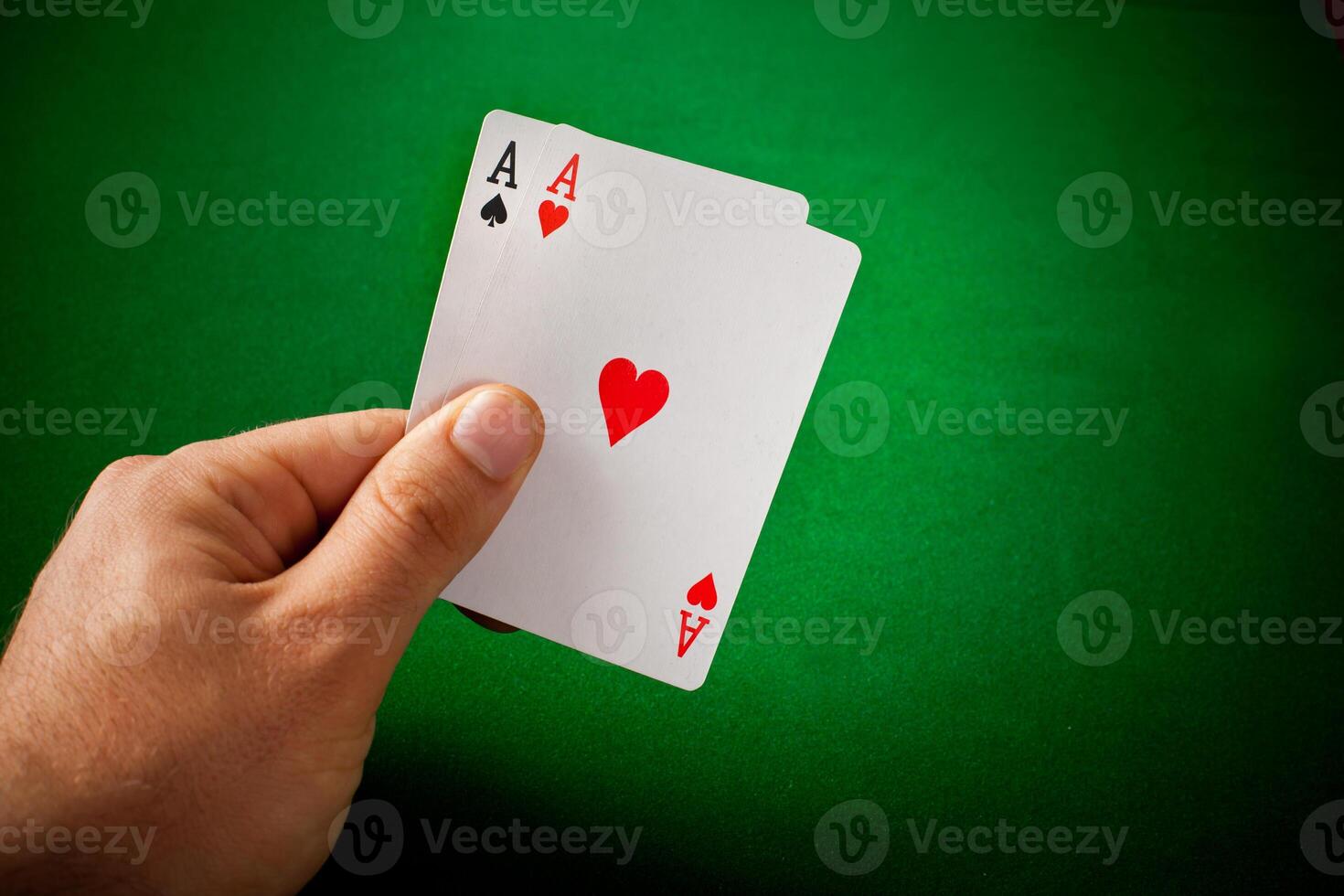 A hand holding a card with a heart on it photo
