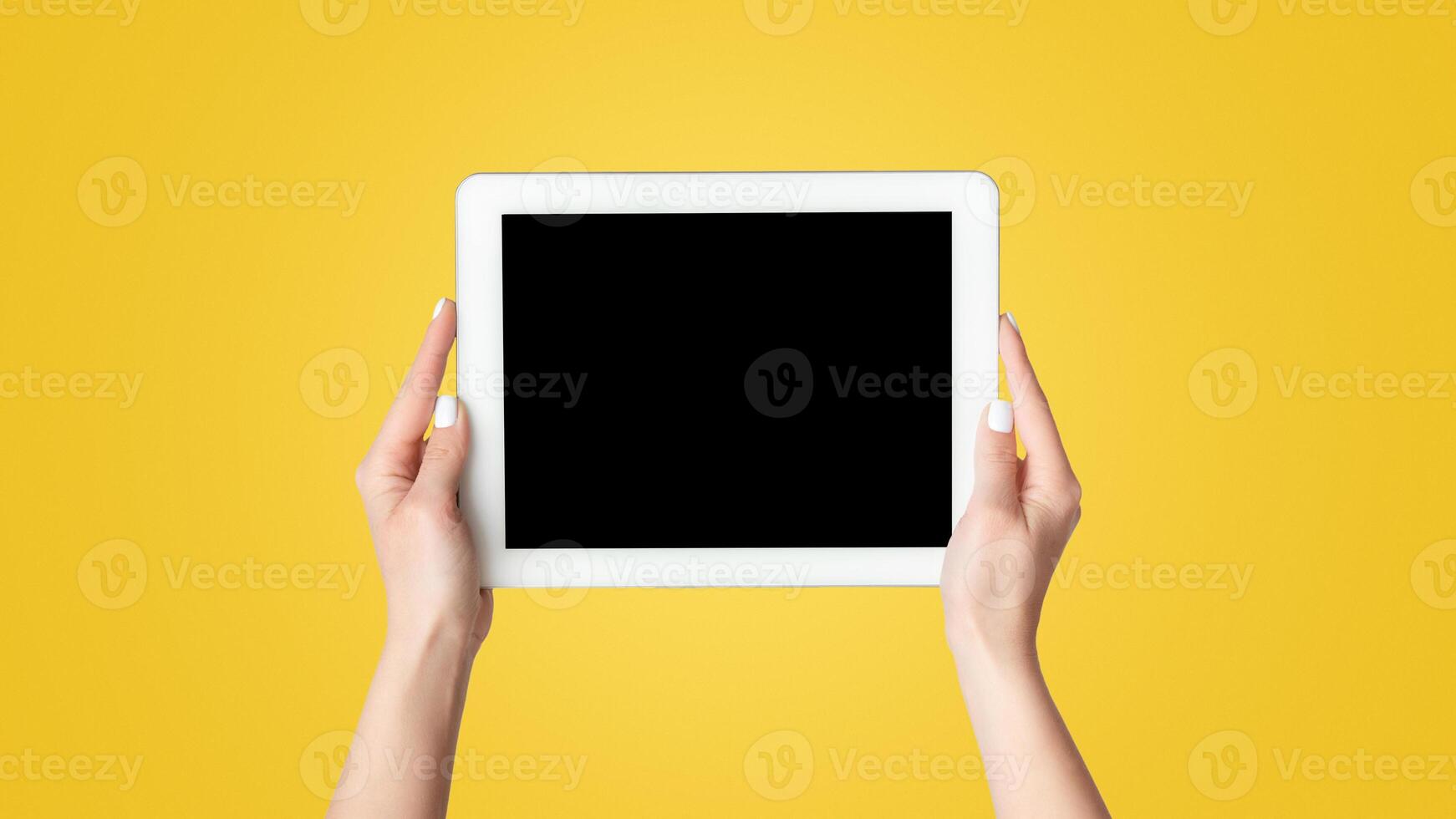 Cropped view of millennial girl showing tablet computer with mockup for design on screen against white background, panorama photo