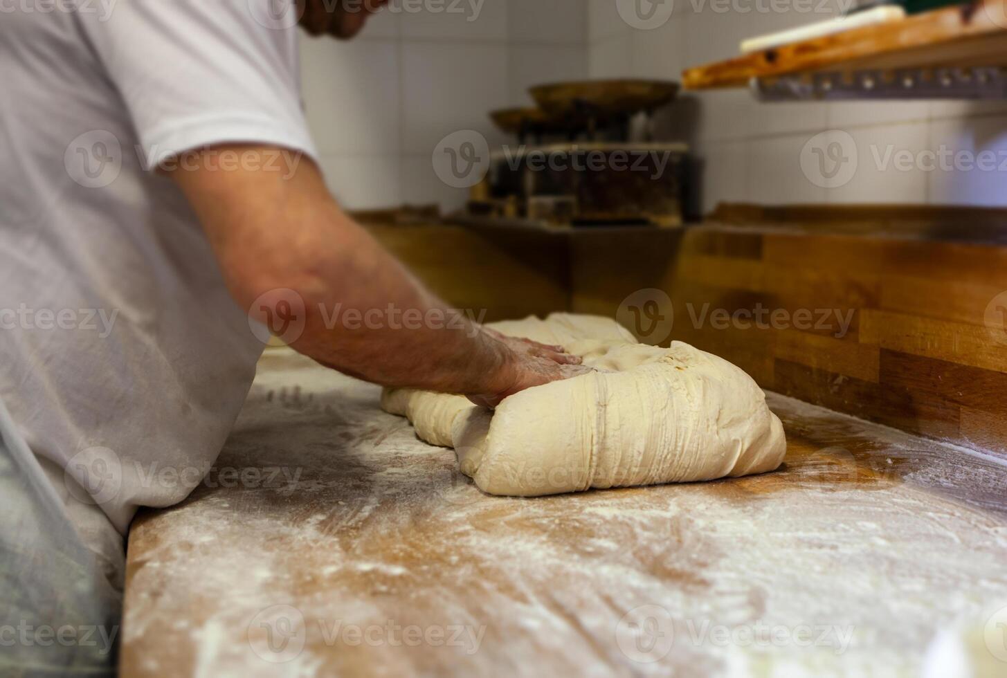 Production of baked bread with a wood oven in a bakery. photo