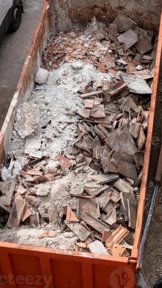 Building rubble and debris ready to be disposed of and recycled. photo