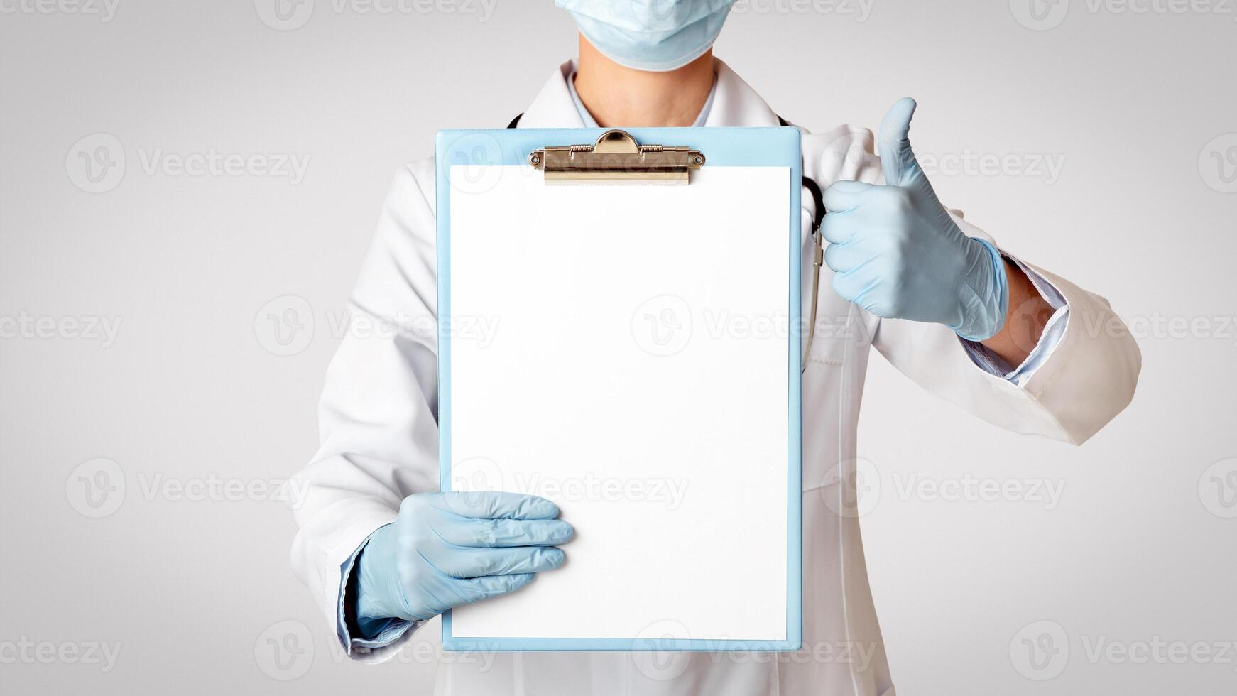 Excellent results, convalescence, diagnostics and treatment. Female doctor in protective mask, white coat and rubber gloves showing thumbs up and tablet for examination with blank space, cropped photo