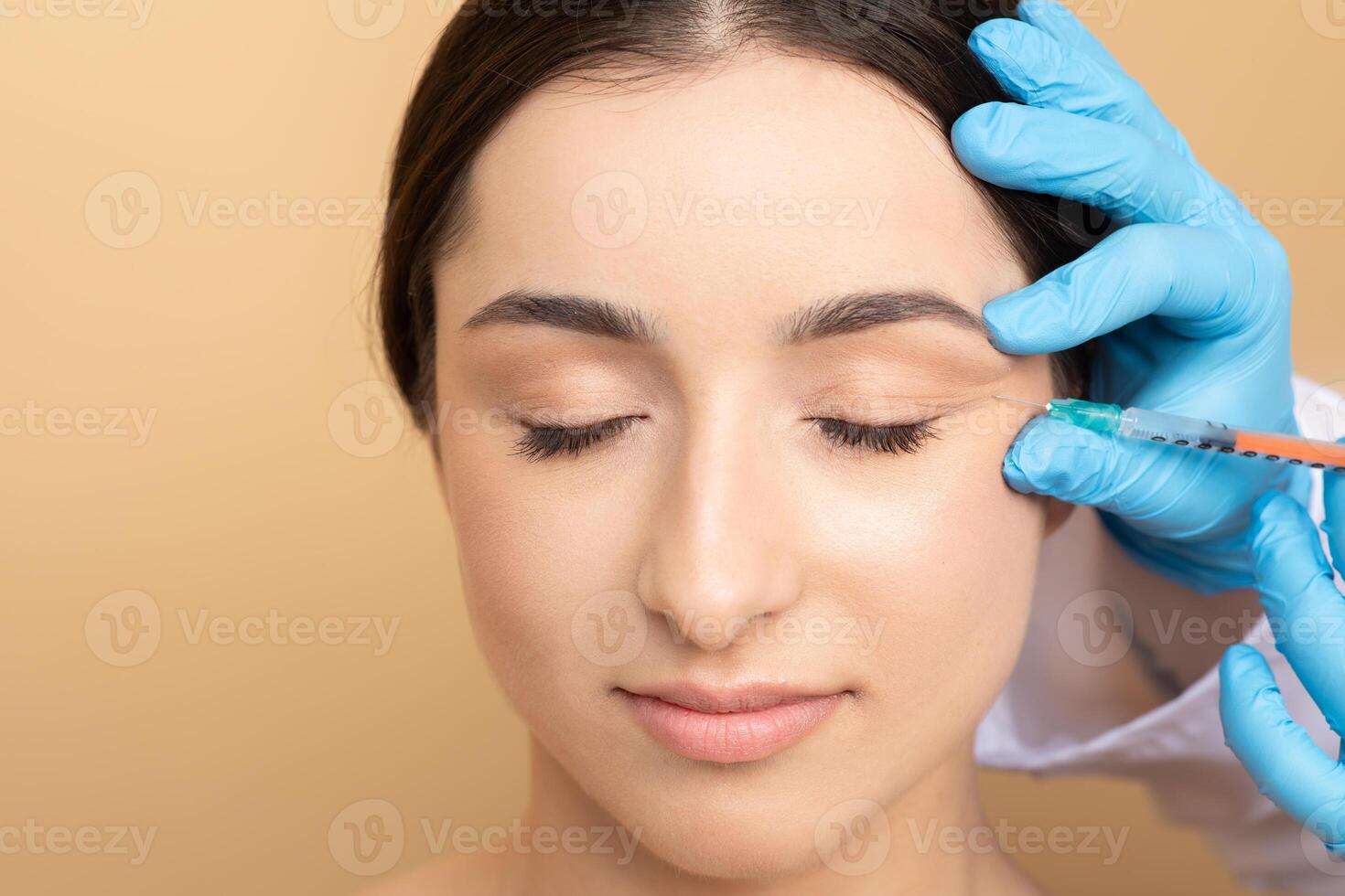 A young European woman enjoys a beauty treatment focused on skin care while relaxing at a spa. She closes her eyes as a professional administers the treatment, emphasizing pampering and wellness. photo