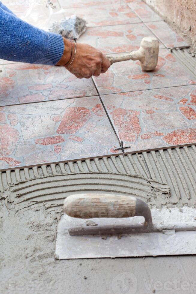 Tiler to work with tile flooring photo