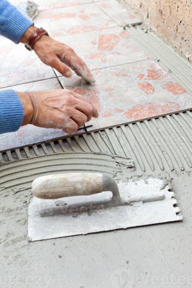 Tiler to work with tile flooring photo