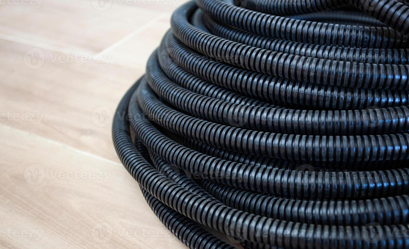 Black corrugated pipe for the cable. photo