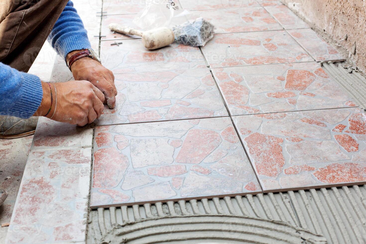 Tiler to work with tile flooring photo