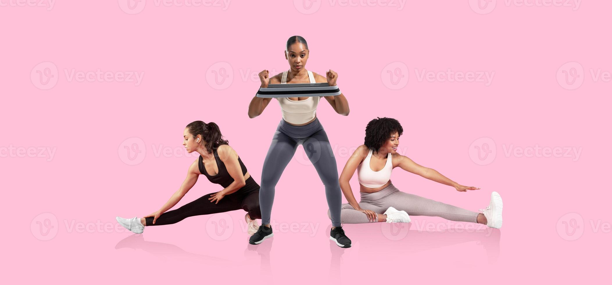 Three women participate in a fitness session on a pink backdrop, showcasing different exercises. One woman lifts a weight while the others stretch, promoting an active lifestyle. photo