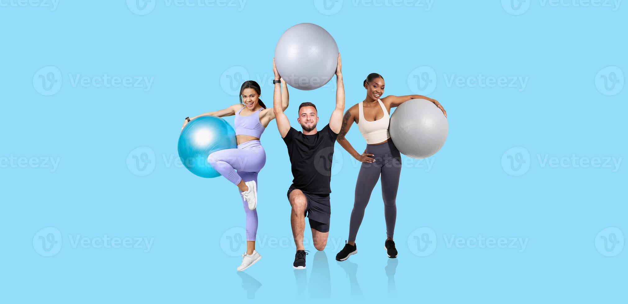 Three fitness enthusiasts demonstrate various poses with exercise balls in a bright studio. The vibrant backdrop and their energy promote an active lifestyle. photo
