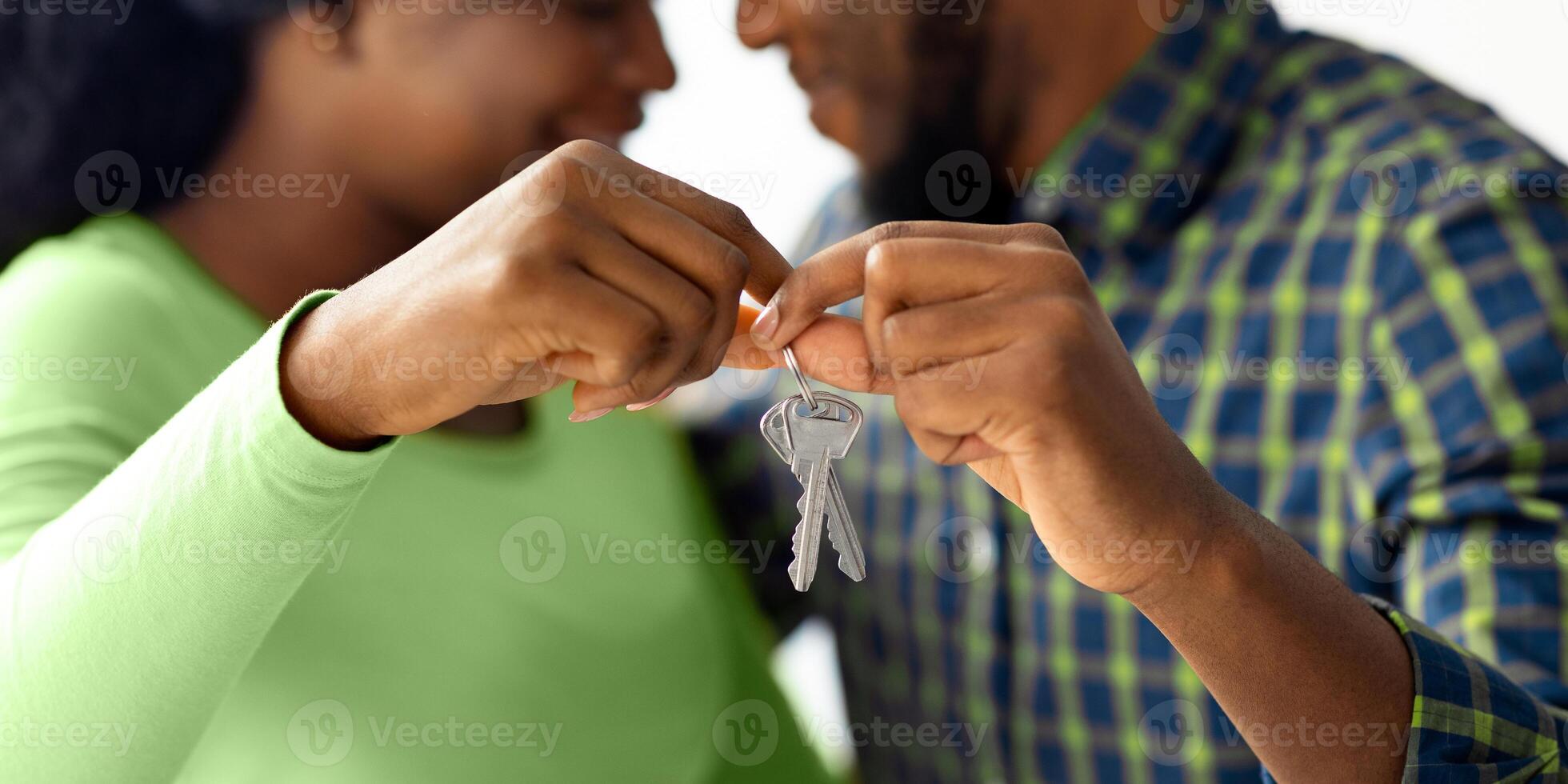 Happy Romantic Black Spouses Holding Keys From Their New Home And Touching Foreheads, Closeup Shot Of Joyful African American Spouses House Owners Celebrating Buying Property, Selective Focus photo