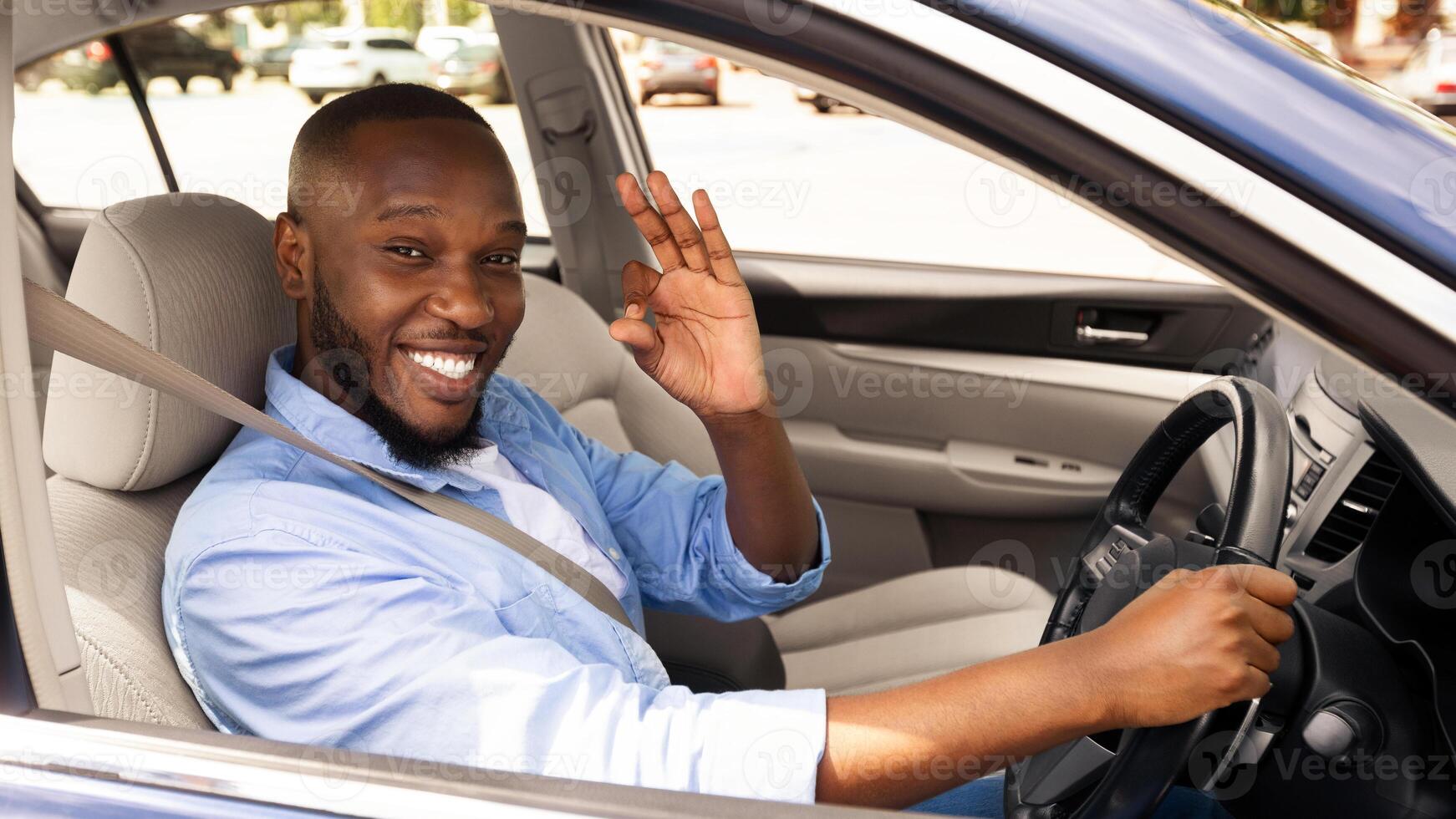 Great Perfect Car. Happy African American Male Showing Okay Sign Gesture, Sitting In New Automobile Buying Modern Vehicle In Dealership Store, Enjoying Vacation, Looking At Camera Through Open Window photo
