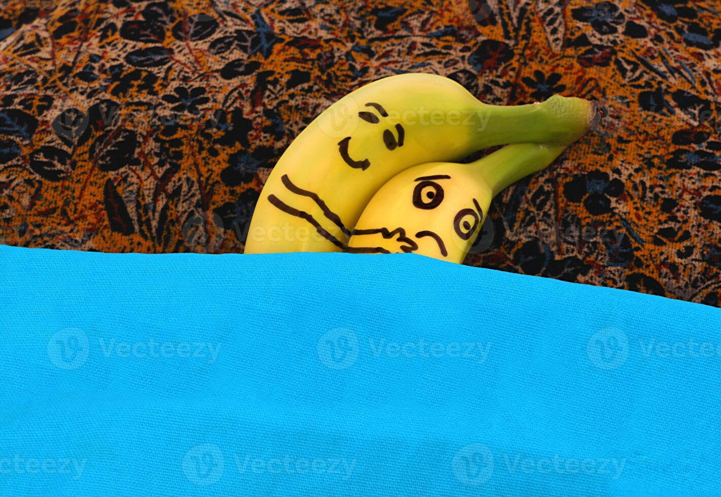 Bananas hugging each in bed. photo